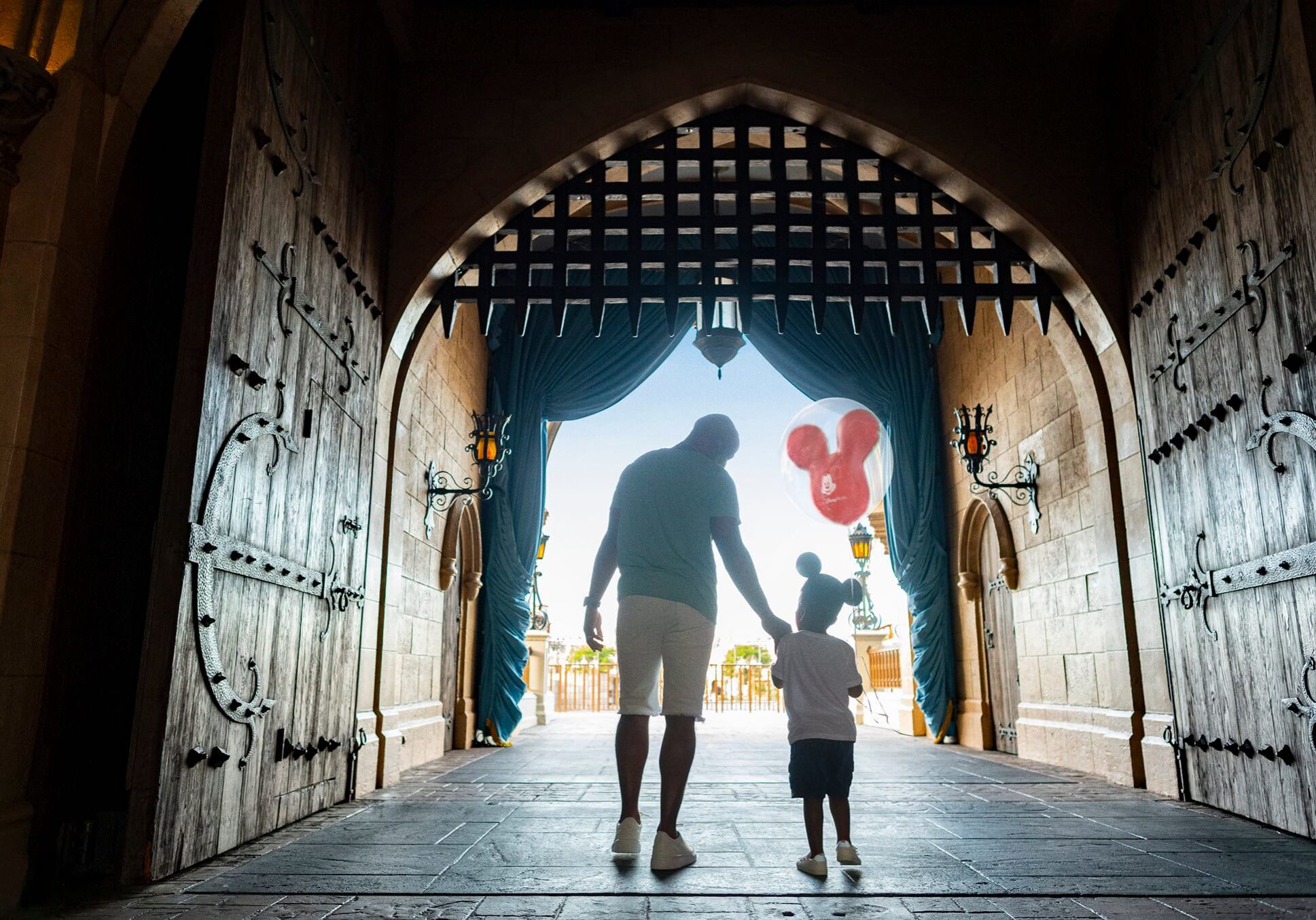 Walt Disney World Father & Son Walking through the Castle at Walt Disney World